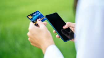 Payment for goods by credit card via smartphone.